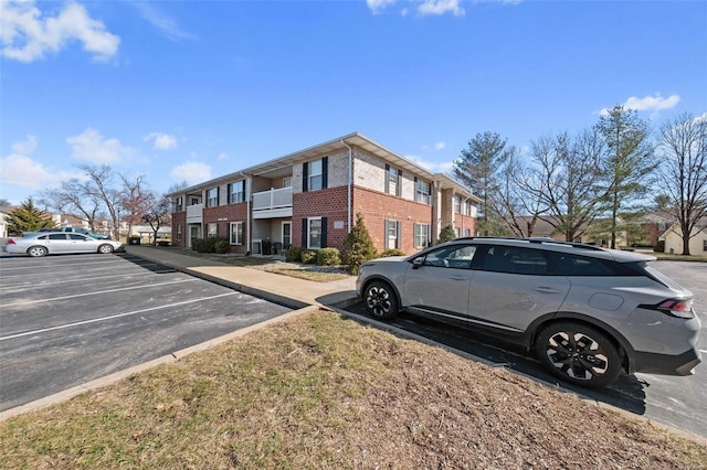 view of street with curbs and a residential view