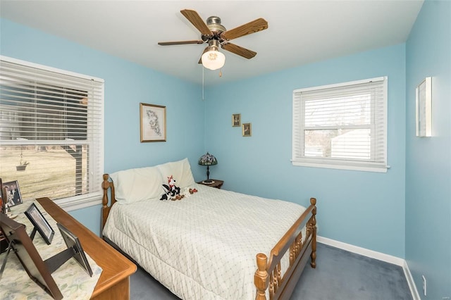 bedroom featuring a ceiling fan, carpet, and baseboards