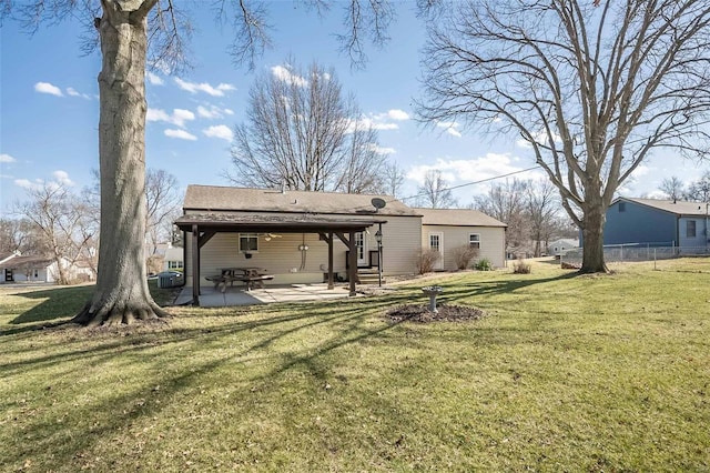 back of house with a patio area, a yard, and fence