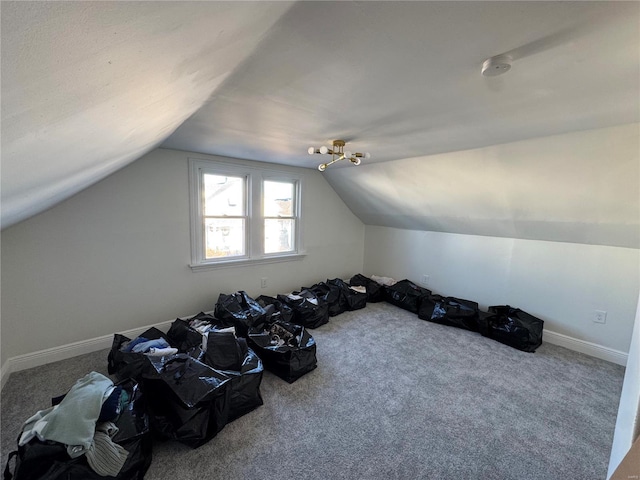 additional living space featuring lofted ceiling, carpet, and baseboards