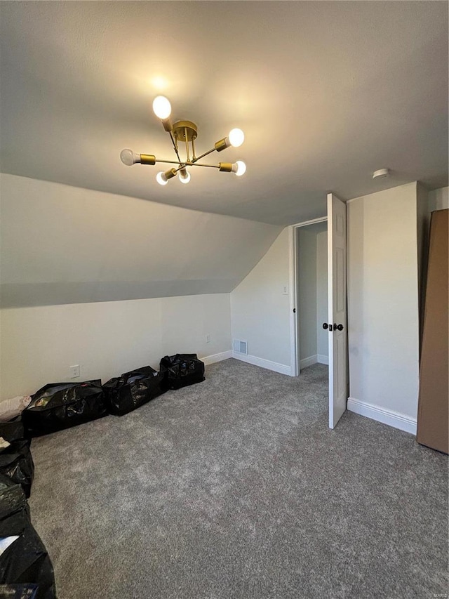 bonus room with carpet flooring, vaulted ceiling, visible vents, and baseboards