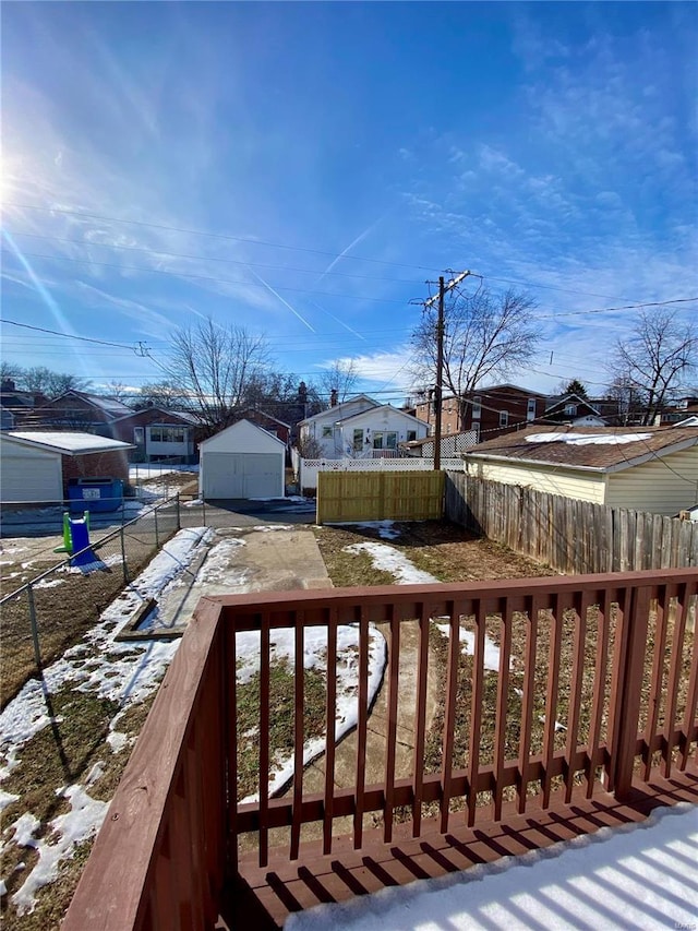 exterior space with a residential view, fence, and an outdoor structure