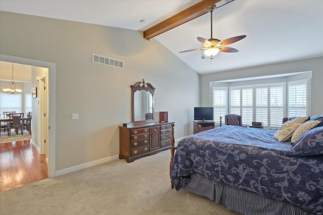 bedroom featuring vaulted ceiling with beams, carpet floors, visible vents, and baseboards