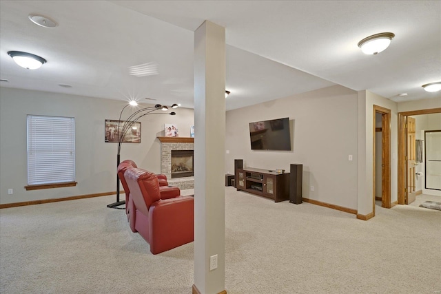 living area with a fireplace, baseboards, and carpet flooring