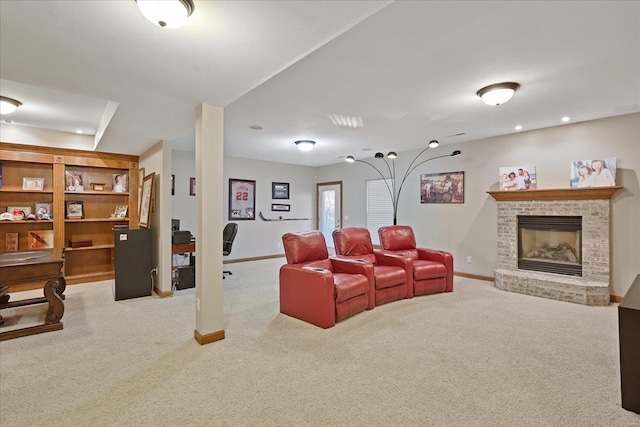 carpeted living room featuring a brick fireplace and baseboards