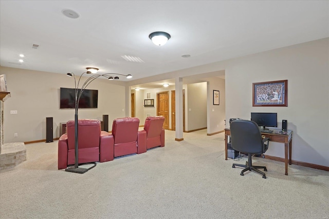 home theater featuring baseboards and light colored carpet