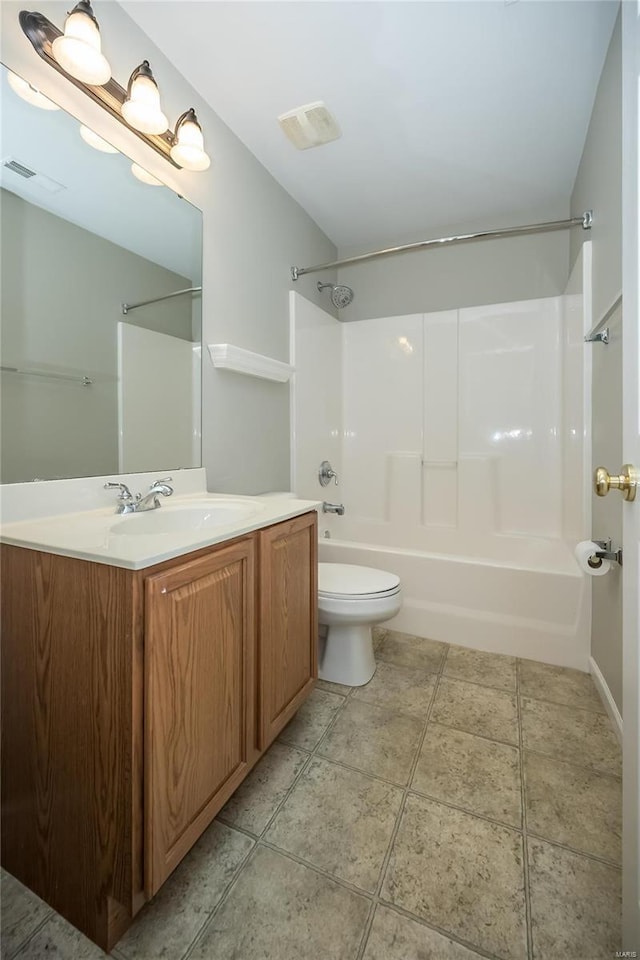 full bathroom with toilet, visible vents, vanity, shower / washtub combination, and tile patterned floors