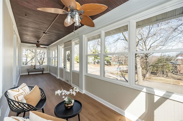 sunroom / solarium featuring wood ceiling