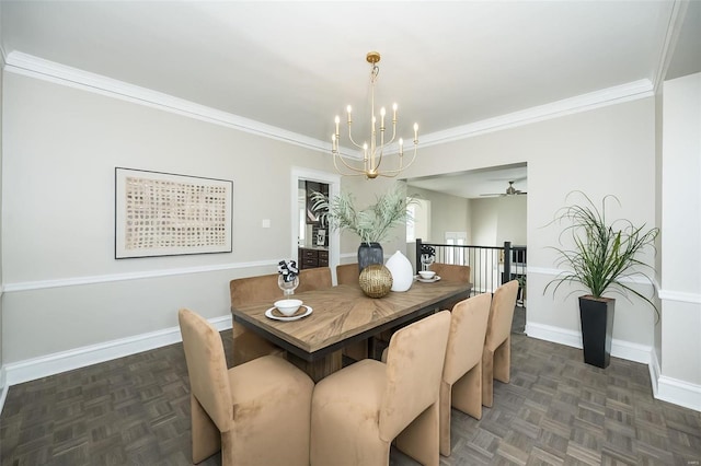 dining area featuring ceiling fan with notable chandelier, ornamental molding, and baseboards