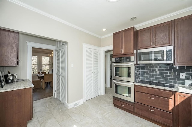 kitchen featuring tasteful backsplash, appliances with stainless steel finishes, light stone counters, and ornamental molding