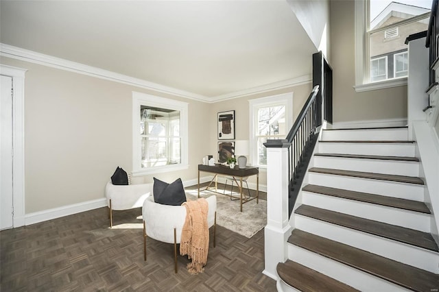 interior space featuring stairs, ornamental molding, and baseboards