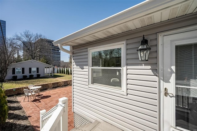 view of property exterior with a patio area