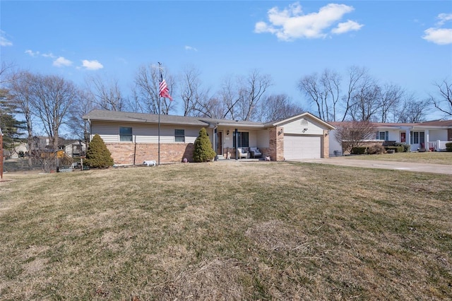 single story home with concrete driveway, brick siding, an attached garage, and a front lawn