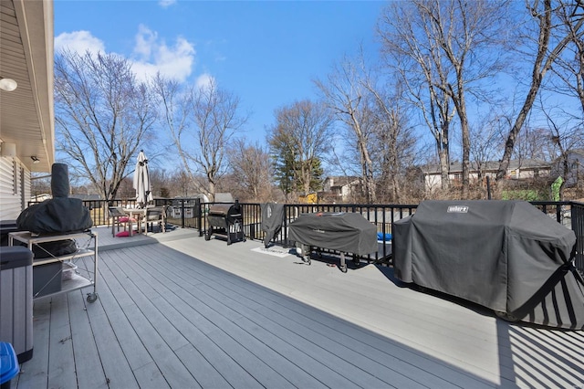 wooden terrace featuring area for grilling