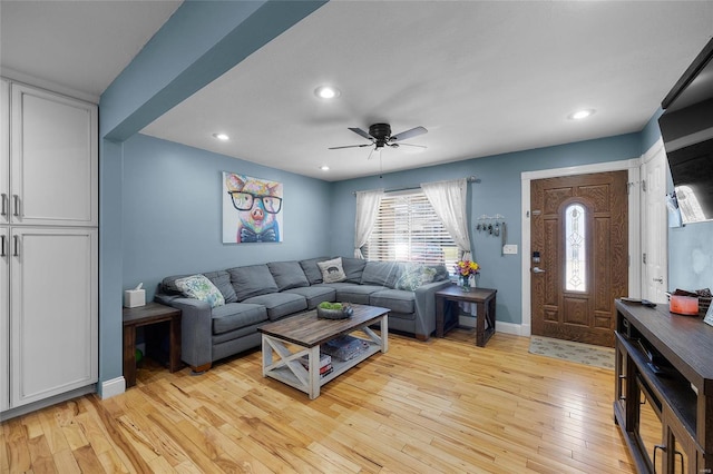 living room featuring ceiling fan, recessed lighting, light wood-type flooring, and baseboards