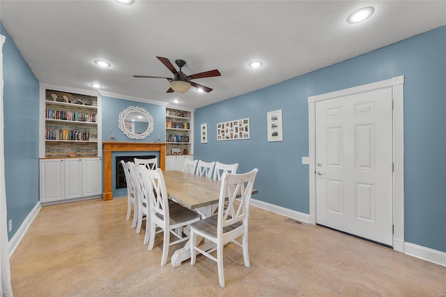 dining area featuring built in shelves, recessed lighting, a ceiling fan, and baseboards