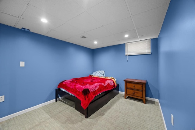 bedroom with a paneled ceiling, recessed lighting, visible vents, and baseboards