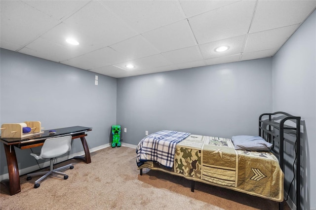 bedroom featuring recessed lighting, carpet flooring, a drop ceiling, and baseboards