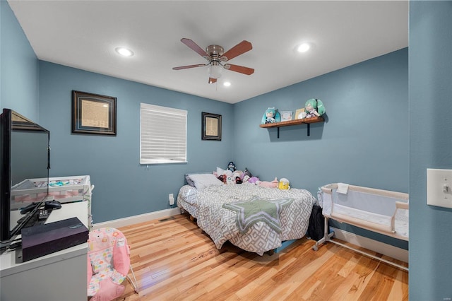 bedroom with ceiling fan, recessed lighting, wood finished floors, and baseboards