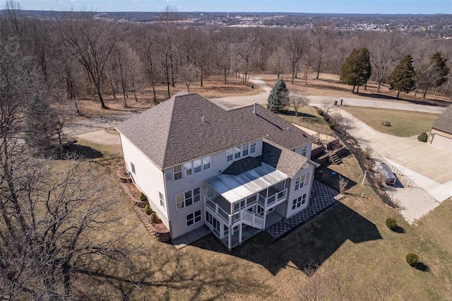 drone / aerial view with a view of trees