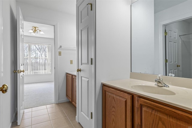 bathroom with tile patterned floors and vanity