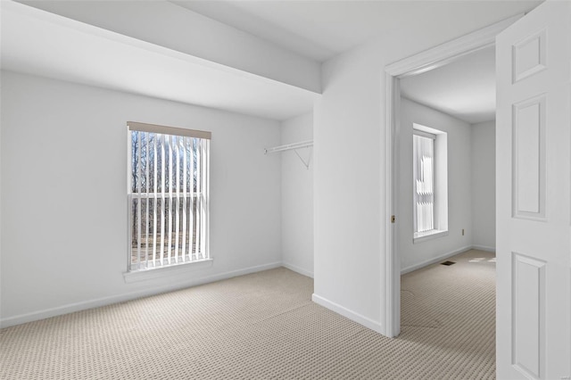 spacious closet with carpet floors and visible vents