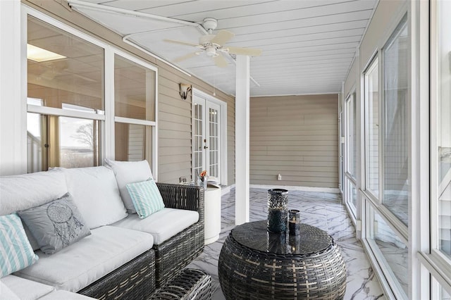 sunroom / solarium with french doors and ceiling fan