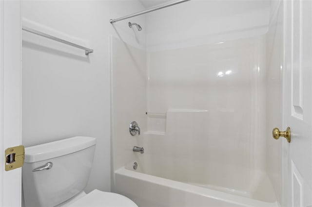 bathroom with toilet and shower / bath combination