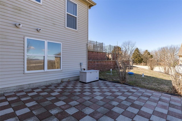 view of patio / terrace featuring fence