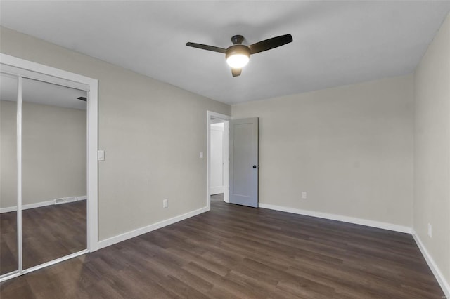 unfurnished bedroom with baseboards, visible vents, ceiling fan, and wood finished floors