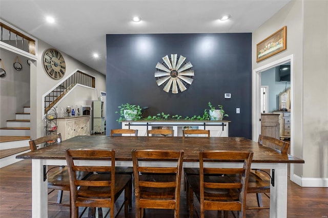 dining room featuring stairway, wood finished floors, and recessed lighting