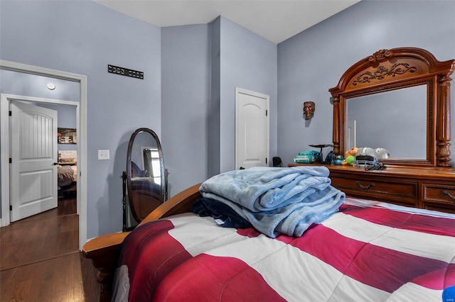 bedroom with wood finished floors