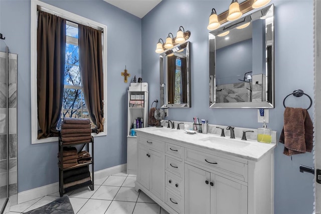 full bathroom featuring double vanity, baseboards, a shower, and a sink