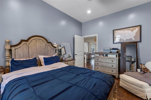 bedroom featuring dark wood finished floors