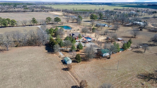 birds eye view of property with a rural view