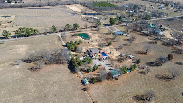 birds eye view of property with a desert view and a rural view