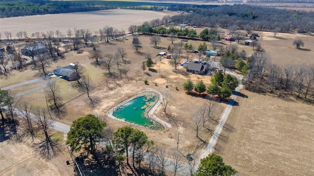 birds eye view of property with a rural view