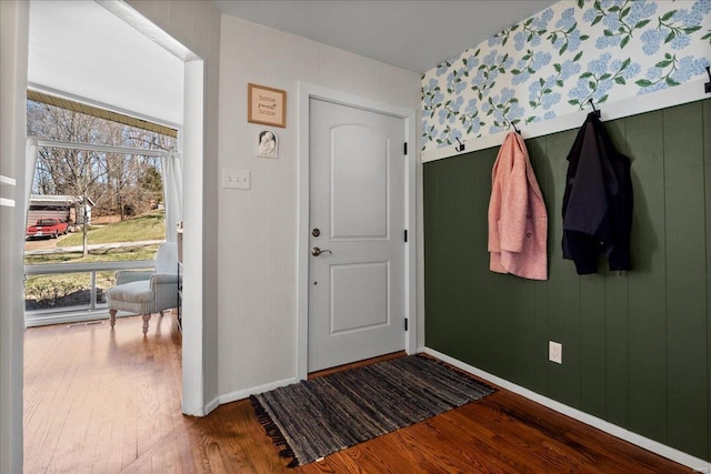 foyer with hardwood / wood-style flooring and baseboards