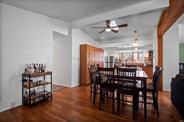 dining area featuring lofted ceiling with beams, baseboards, dark wood-type flooring, and ceiling fan