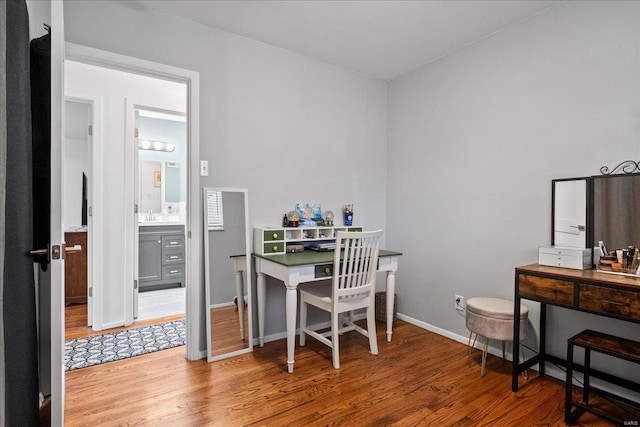 office area with wood finished floors and baseboards