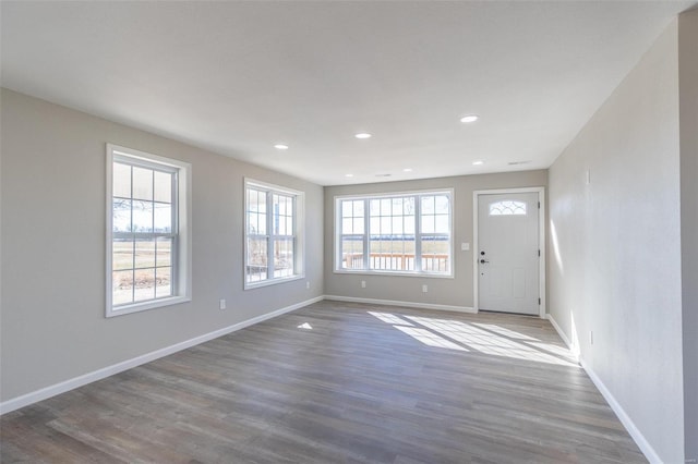 interior space with recessed lighting, baseboards, and wood finished floors