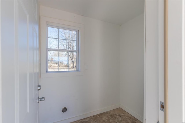 interior space featuring baseboards