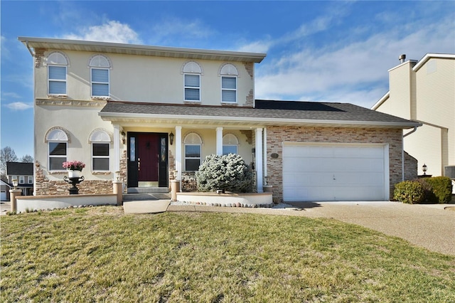 view of front facade with driveway, a shingled roof, an attached garage, a front lawn, and stucco siding