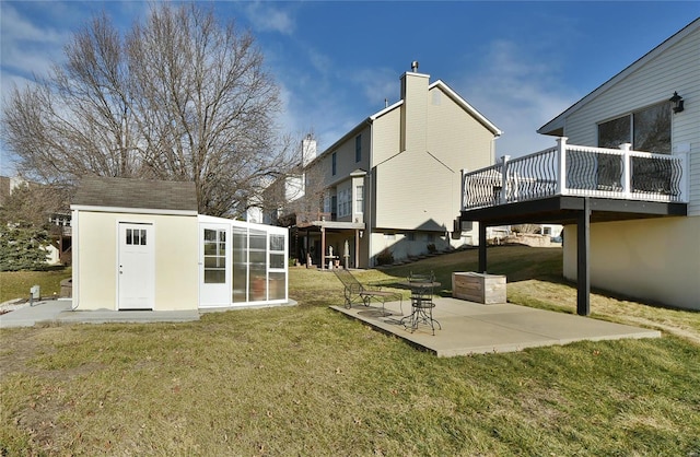 view of yard featuring an outbuilding and a patio