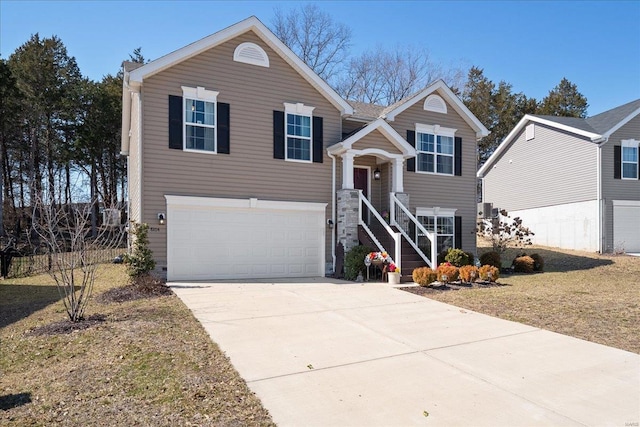 view of front of house featuring driveway and a garage