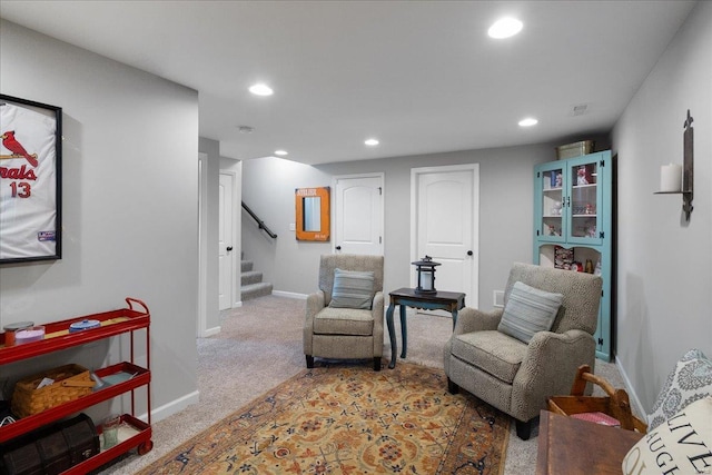 sitting room featuring stairs, carpet, baseboards, and recessed lighting