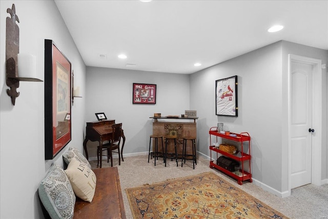 interior space featuring carpet floors, baseboards, a dry bar, and recessed lighting