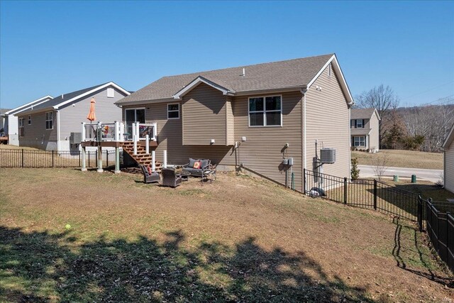 rear view of house featuring a lawn, stairway, fence private yard, cooling unit, and a wooden deck