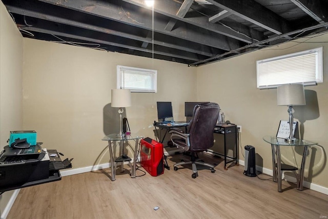 office space featuring wood finished floors and baseboards