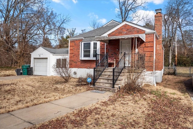 view of front of property with a garage, brick siding, fence, concrete driveway, and a chimney